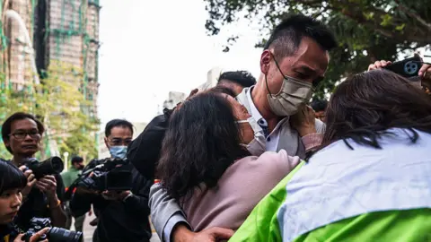 Tragedy Strikes in Hong Kong: Families Left Waiting for News After High-Rise Blaze