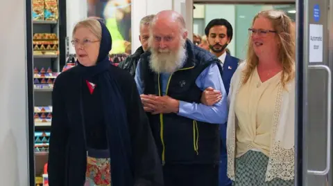 British Couple Freed from Taliban Custody Returns to UK