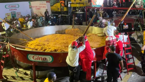 Chef Hilda Baci Attempts to Create the Largest Pot of Jollof Rice in History