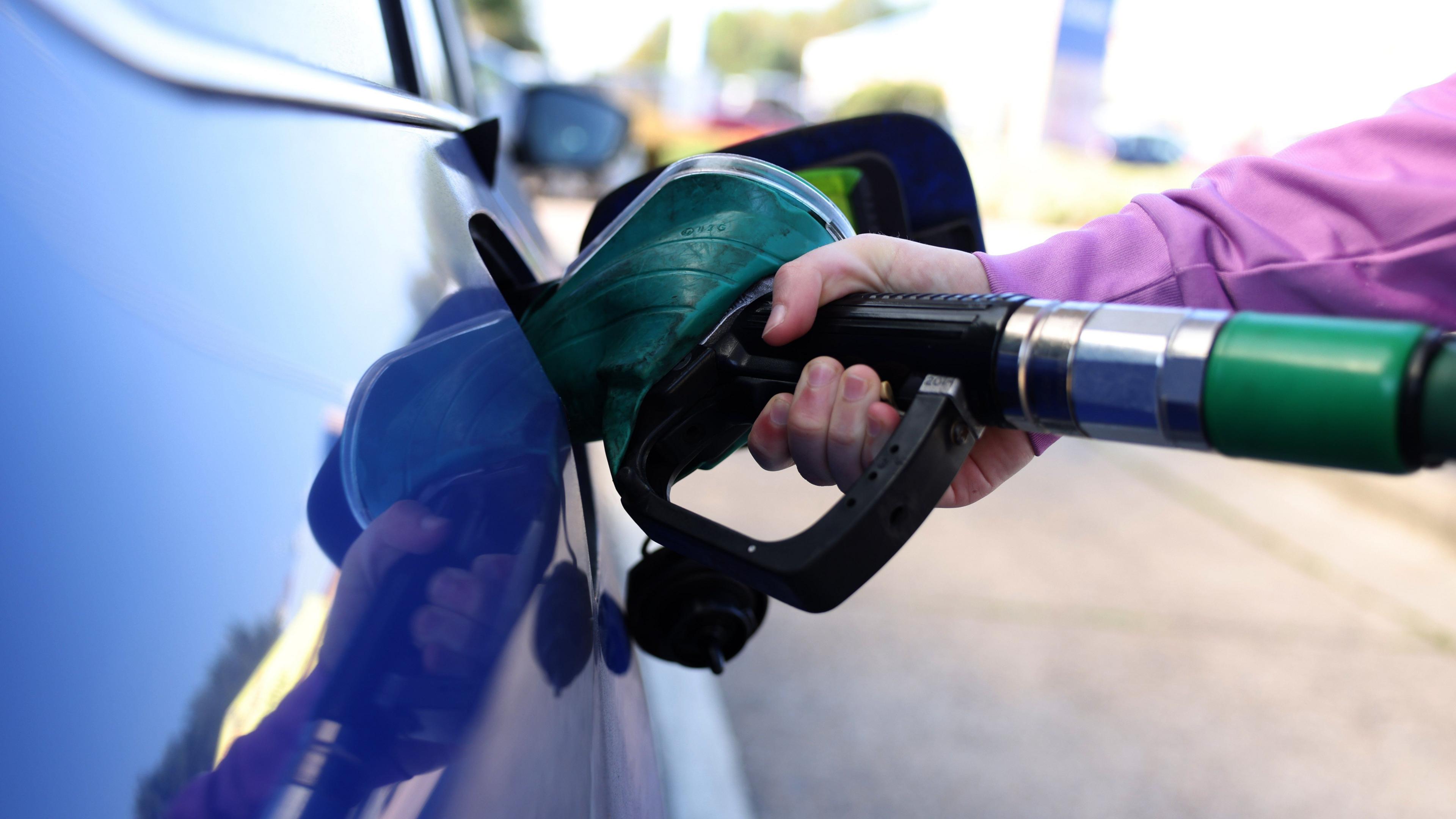 Diesel fuel being pumped into a car
