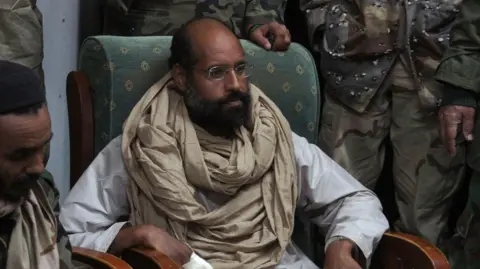 Saif al-Islam Gaddafi, Son of Ex-Libyan Leader, Reportedly Killed in Assassination