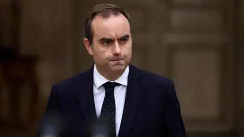 French Prime Minister Secures Key Budget Vote Amid Political Turmoil