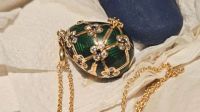A stunning diamond-studded Fabergé egg locket was recovered by New Zealand police after a man swallowed it in an attempted theft at a jeweler's store. The 32-year-old suspect has been charged with theft.