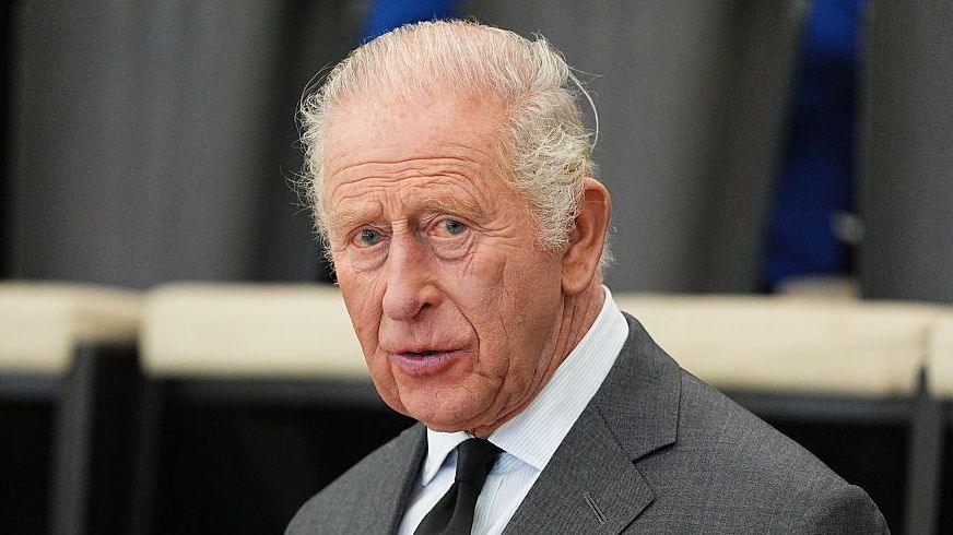 King Charles in a grey suit